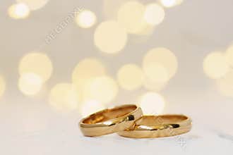Wedding background with two golden rings