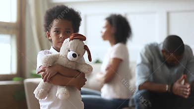 Sad boy holding toy looking at camera, divorce and children