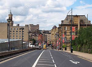 A view of bradford city center from bridge street next to the interchange with hotels and shops visible at the bottom of the road