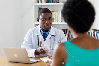African american doctor talking about cancer with patient