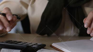 Elderly male holding utility bills, calculating incomes and expenses, economy