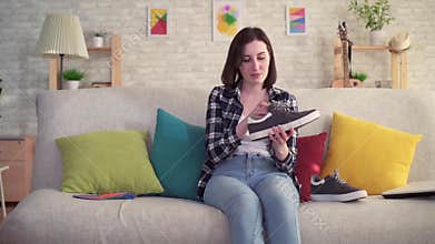Young woman inserts an orthopedic insole into the Shoe