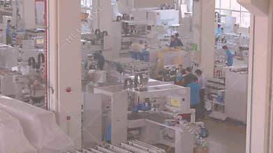 People work in a modern CNC machine tool manufacturing company