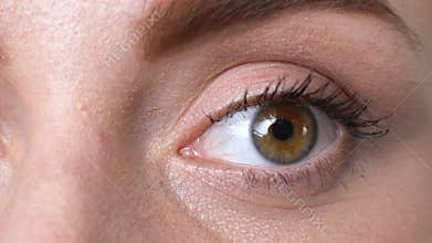 Closeup of female blinking, suffering dry eye syndrome, vision problems fatigue