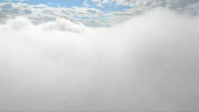 Flying through clouds. Blue sky on the background of a bunch of clouds. Clouds flying, moving heavenly sky video footage