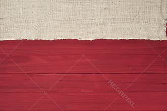 Rustic Red Wood Boards in Flat layout with off white Burlap fabric on top side as decorative design element.  It`s horizontal but