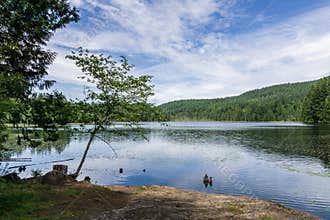 Landscape view killarney lake bowen island canada and blue sky.