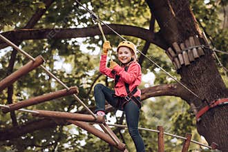Hike and kids concept. Toddler kindergarten. Eco Resort Activities. Happy child boy calling while climbing high tree and