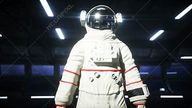Alone astronaut in futuristic space corridor, room. view of the earth. cinematic 4k footage.