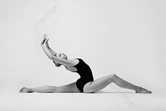 Beautifull flexible blonde girl posing. Gymnastics.