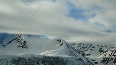 Snow mountains cloudy winter landscape nature sun timelapse
