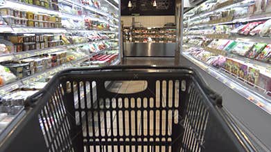 4K An Asian supermarket with products on the shelves. Shopping With Trolley