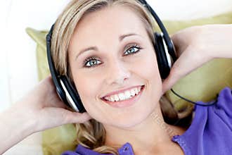Portrait of a woman listening to music
