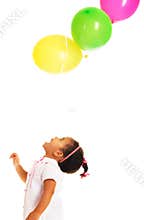 Pretty little girl playing with balloons