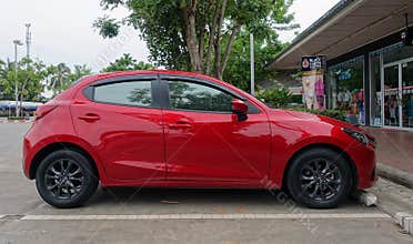 Red Mazda 2 model 2015