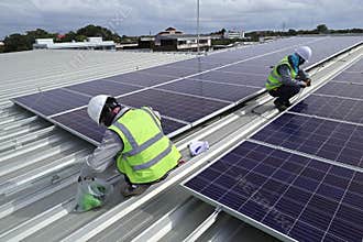 Technician Connecting Cable of Solar Rooftop
