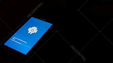 Moscow, Russia - July 2019: Android robot logo icon on the screen of a Samsung smartphone during the installation of a
