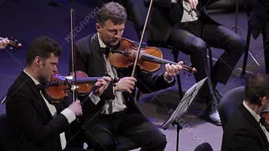 Musicians play in the orchestra on stage. Kyiv. Ukraine