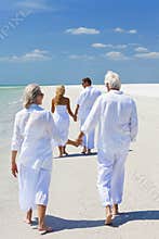 Two Couples Family Generations Walking on Beach