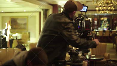 Cameraman with a camera during filming. Filmmaking. Shooting.