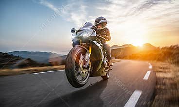 Fast motorbike on the coastal road riding. having fun driving the empty highway on a motorcycle tour journey
