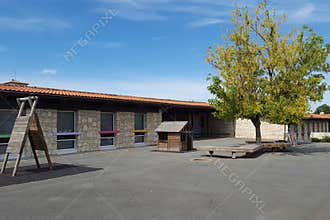 Empty schoolyard preschool building school playground