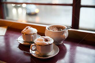 Two cups of coffee at a cafe