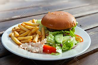 Burger with salad and french fries