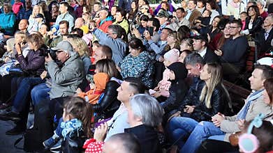 Moscow, Russia - October 01, 2019: An audience, crowd in a outdoor concert clapping, applauding the actors