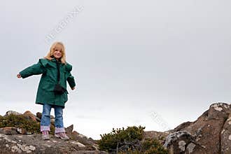 Little girl on mountain top