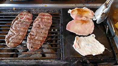 BBQ beef and  pork on grill at restaurant