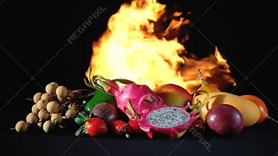 Video exotic fruits in the fire on black background