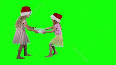 Best friends girls can`t share gift on Christmas. Children fight for present box