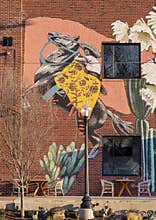 Mural featuring a woman on a horse on a restaurant wall in the Bishop Arts District in Oak Cliff in Dallas, Texas