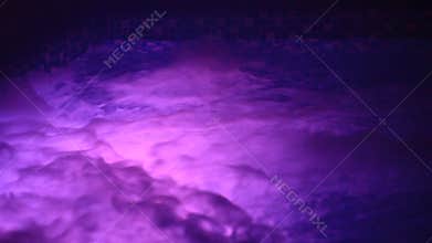 Jacuzzi with blue and red lighting. Seething water.