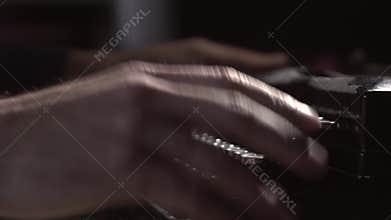 Writer types on typewriter keyboard