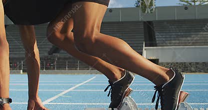 Mixed race athlete preparing for race in stadium
