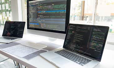 Programmers work on the development of coding and coding technology on white desks and website design, software, data processing