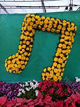 Music logo icon of music symbol decoration with flowers