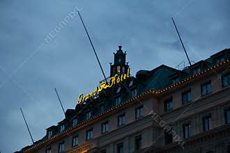 Stockholm, Sweden - July 14, 2019: The lit sign of Grand Hotel in Stockholm during a warm summer evening