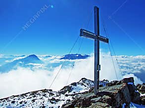 Alpine peak Falknis in the Ratikon border mountain massif or Raetikon Grenzmassiv and over the river Rhine valley Rheintal