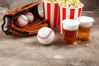 Popcorn on the table with draft beer. Baseball party food with balls for the playoffs