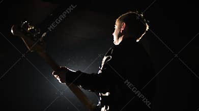 Live performance jazz melody on bass instrument by art people on stage concert