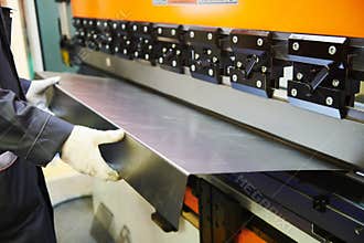 Hydraulic press brake or bending machine for flat sheet metal.