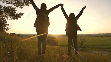 Free girls travel, walk in forest, park and enjoy victory, raise their hands up and enjoy the sunset. Hiker Girl