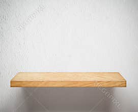 Empty wooden shelf or bookshelf on white wall