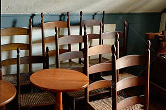 Shaker chairs and tables gathered in a group
