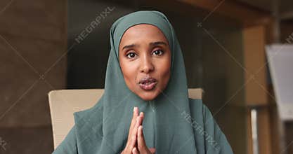 Somalian businesswoman in hijab lead on-line talk to client