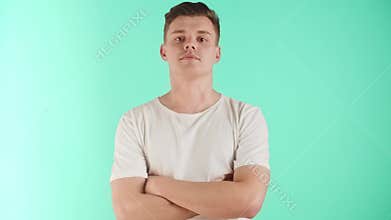 The guy an arrogant look with a challenge. The young man demonstrates self-confidence and a sense of superiority