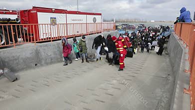 Ukrainian refugees, mostly women and children, flee the war in Ukraine to Romania across the Danube River on a ferry boat.